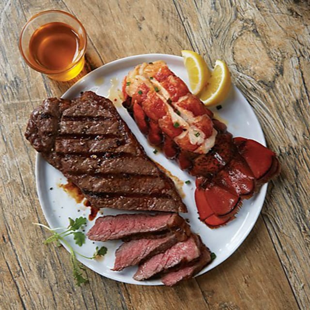 Surf and Turf-Steak & Lobster with Hibachi Fried Rice and Broccoli.